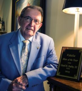 Dr. Lloyd H. Darby III with one of his many accolades for community service.