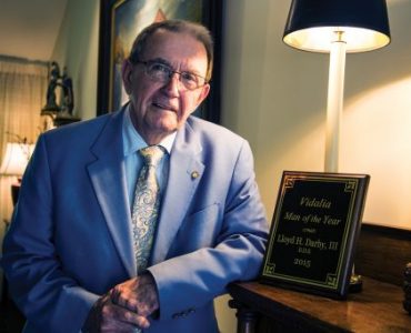 Dr. Lloyd H. Darby III with one of his many accolades for community service.