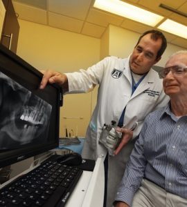 Dr. Mike Pruett meets with Hugh Morton. Photo By Phil Jones.