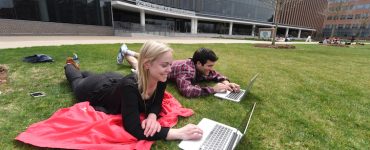 Students on lawn of Harrison Education Commons