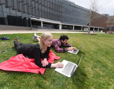 Students on lawn of Harrison Education Commons