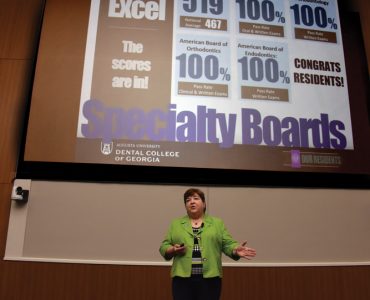 Carol Lefebvre presents the State of the College address.