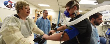 Respiratory therapist Reva Crandall, Dr. Ryan Harris, vascular technologist Marsha Backburn, study participant Damon Jenks, and research associate Jacob Looney