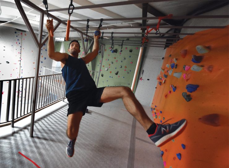 Jackson Griffeth scales ninja obstacles at Active Climbing Augusta. Photo by Phil Jones.