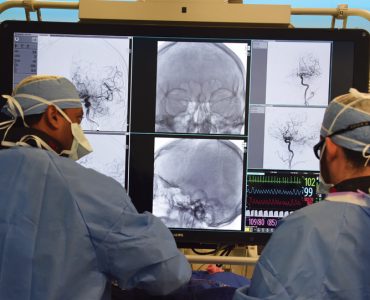 doctors look at clot