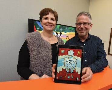 Dr. Tara Schafer and Jeff Mastromonico with app.