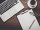 laptop,clipboard and coffee on desk