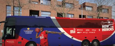 The New Heroes basketball team’s bus features Keshun Sherrill (BA ‘17).