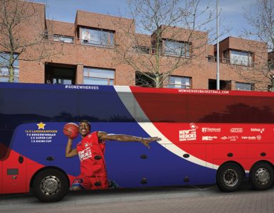The New Heroes basketball team’s bus features Keshun Sherrill (BA ‘17).