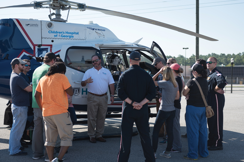 Coule participates in numerous training exercises. He leads a group of residents to the hospital’s helipad, circa 2017. courtesy of Greg Hartshorne.