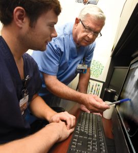 Dr. Bob Shiflett (right) with resident Chaz Plaisance