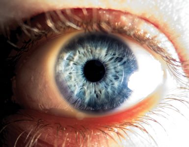 Close-up of blue human eye in strong light