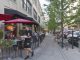 ASHEVILLE, NORTH CAROLINA - JUNE 29, 2017: A busy downtown Asheville street lined with cafes, restaurants, benches and tourists on a summer afternoon