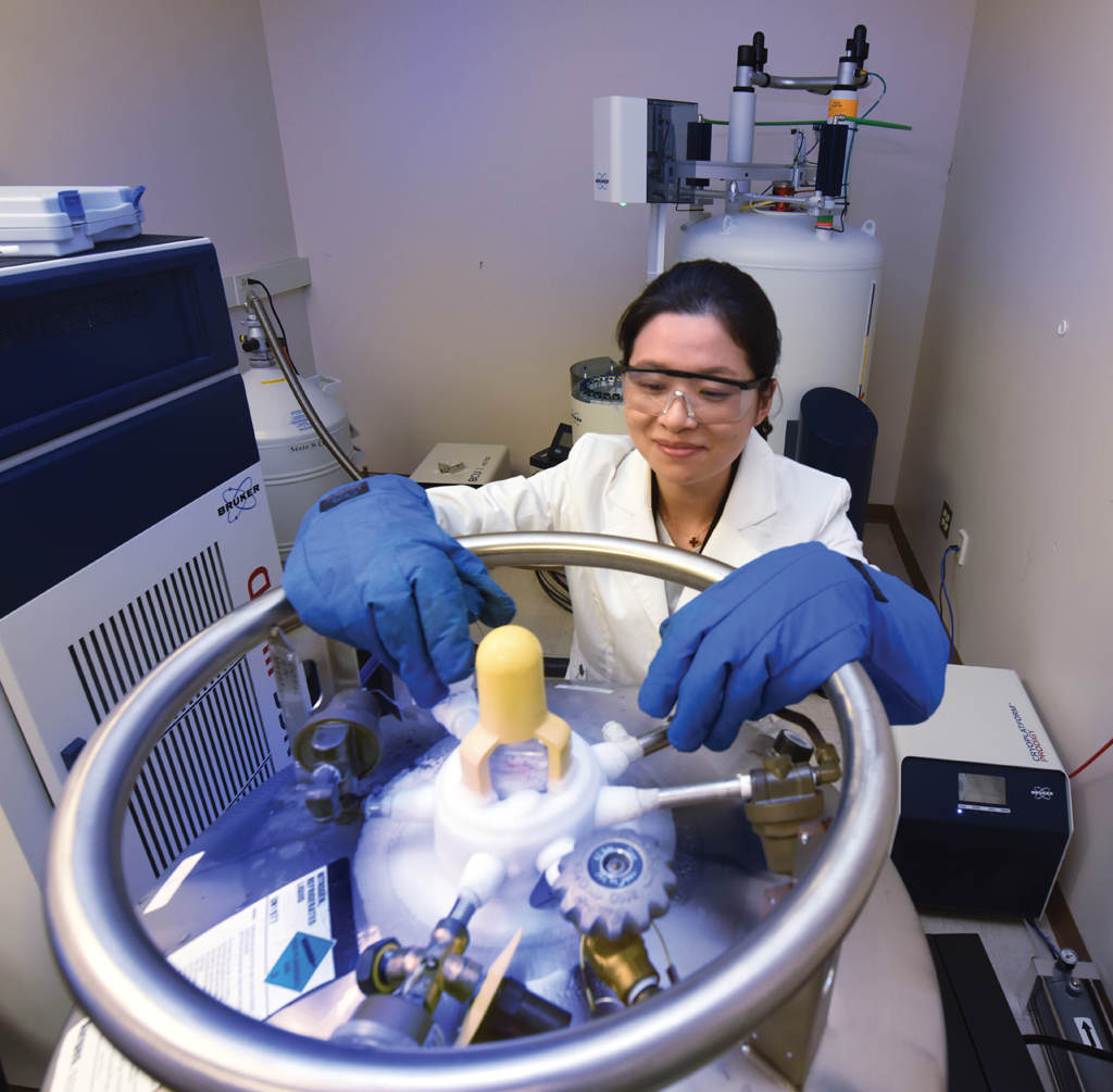 Juan Zou at the Clinical and Biomolecular Analysis Facility. Photo by Phil Jones.