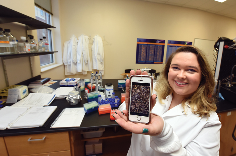 Deanna Doughty shows off cell cultures. 