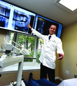 Dentist pointing at x-ray