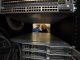 Two women looking through window in server farm