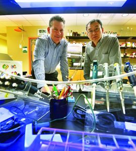 Dr. Joseph Miano and Dr. Lin Gan in lab