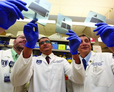 Researchers looking at slides