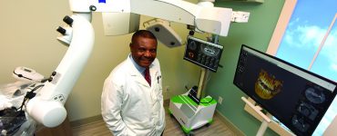 Dr. Emmanuel Ngoh in treatment room