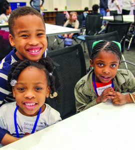 Children smiling at camera