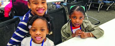 Children smiling at camera