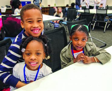 Children smiling at camera