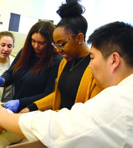 Students looking at research