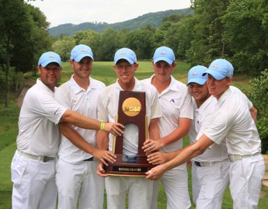 golfers holding trophy