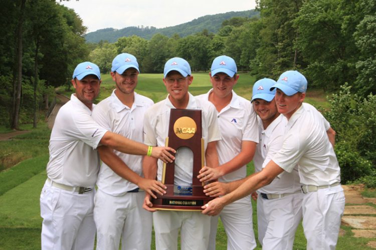 golfers holding trophy