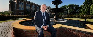 man sitting at fountain