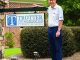 Man in front of sign