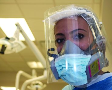 Dentist in personal protective gear due to COVID-19 pandemic