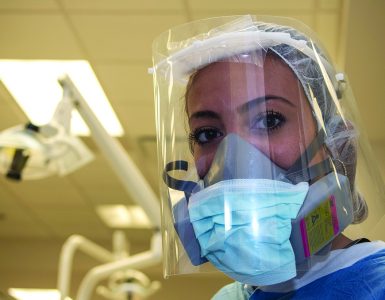Dentist in personal protective gear due to COVID-19 pandemic