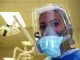 Dentist in personal protective gear due to COVID-19 pandemic