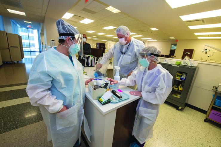 Scientists in clinic wearing masks