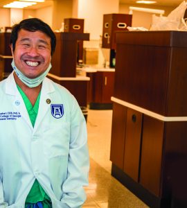 Scientist standing in lab - Dr. Kim Capehart