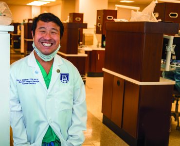 Scientist standing in lab - Dr. Kim Capehart