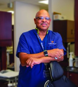 Man named Maurice Lewis smiling in dental clinic