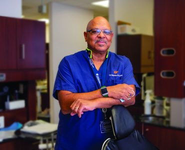 Man named Maurice Lewis smiling in dental clinic