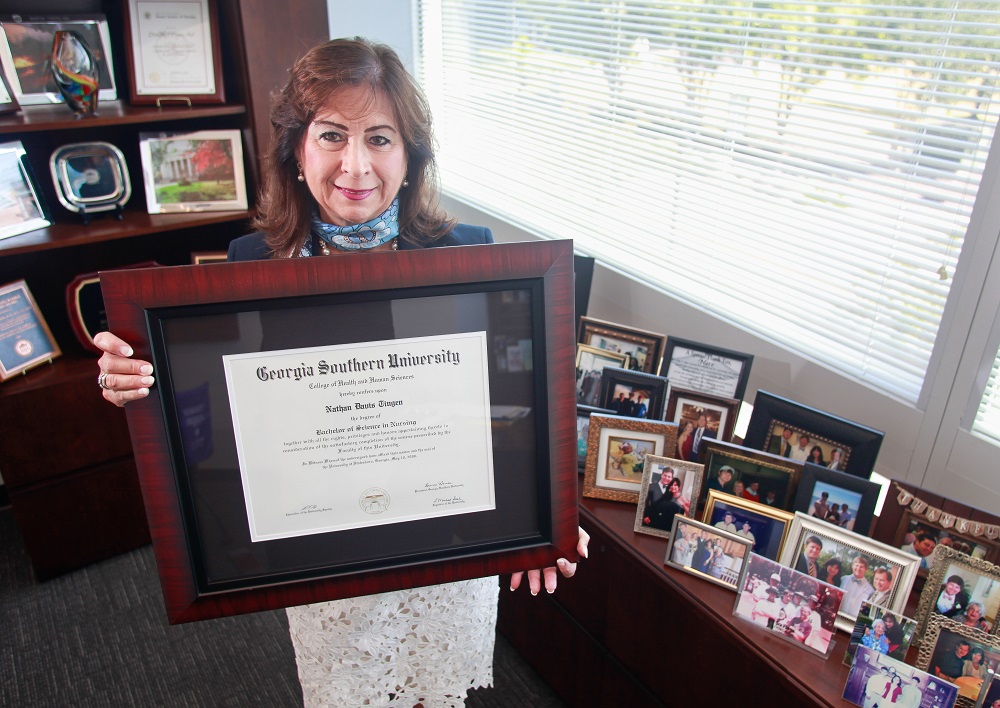 woman holding diploma