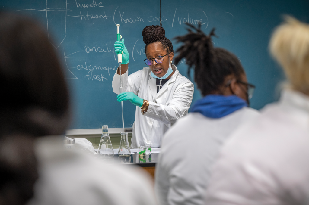 Female scientist lecturing a class