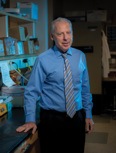 Man poses in lab