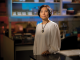 woman scientist in lab poses for camera