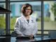 Female scientists poses for camera