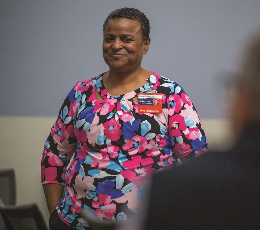 Woman smiles posing for camera