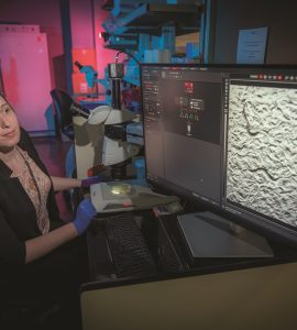 Dr. Danielle Mor looks at her computer in her lab.