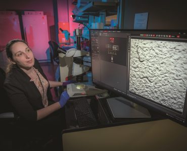 Dr. Danielle Mor looks at her computer in her lab.