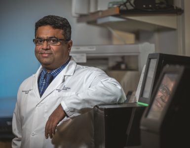 Dr. Ravindra Kolhe poses for the camera in his lab.