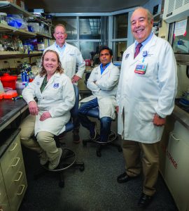 Drs. McGee-Lawrence, Hamrick, Fulzele, Isales pose in lab.